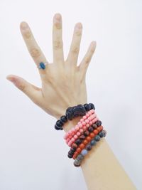 Close-up of human hand against white background