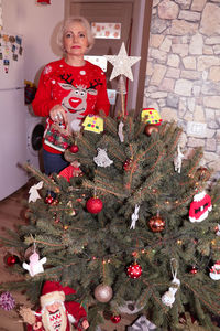 Portrait of happy girl with christmas tree