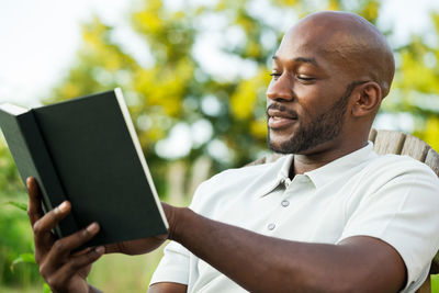 Close-up of man using mobile phone