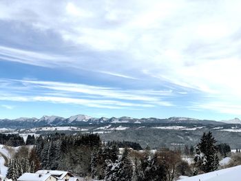 Scenic view of snowcapped mountains against sky