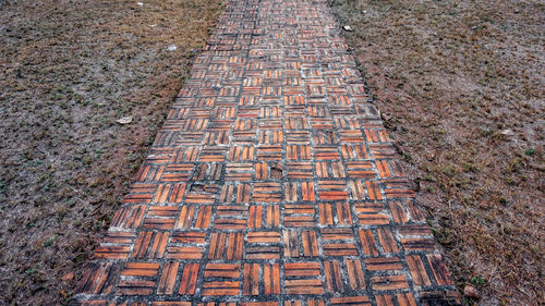 High angle view of cobblestone street in field
