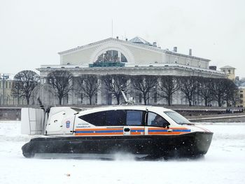 Car on road against clear sky during winter