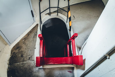 Rear view of red staircase against building