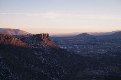 Scenic view of mountain range against sky during sunset