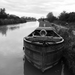 Boats in river with buildings in background