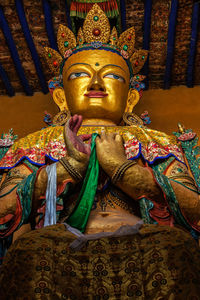 Buddha statue in temple outside building