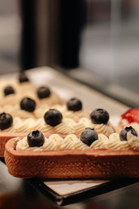 Delicious sweet cake with fresh blueberries and butter cream