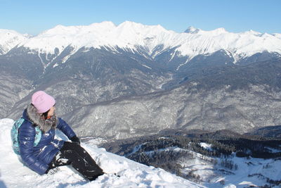 Man skiing on snowcapped mountains