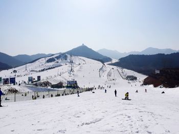 Scenic view of snow covered mountains against sky