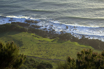 High angle view of landscape and sea