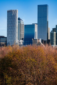 Modern buildings against clear blue sky