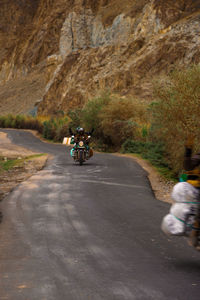 Man riding motorcycle on road