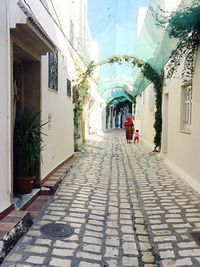 Woman walking in corridor of building