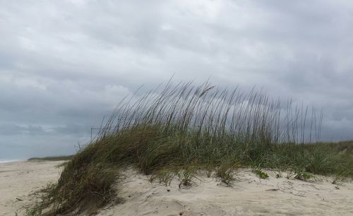 Scenic view of sea against cloudy sky