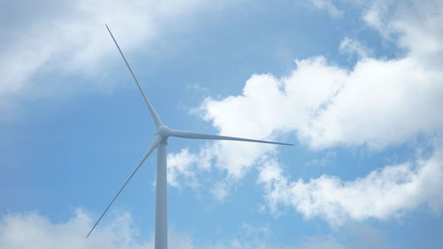 Low angle view of wind turbine against sky