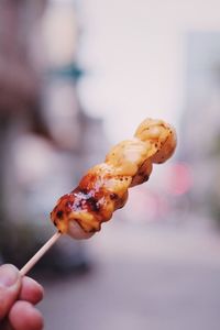 Close-up of hand holding ice cream