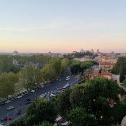 High angle view of city against sky at sunset