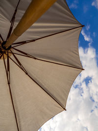 Low angle view of umbrella against sky