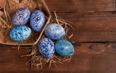 High angle view of eggs in basket on table
