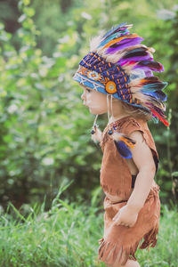 Cute baby dressed in traditional native american costume