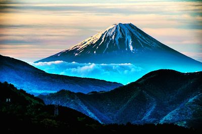Scenic view of mountains against sky during winter