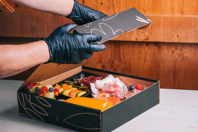 High angle view of man preparing food on table