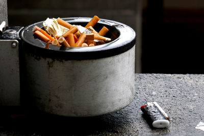 Close-up of cigarette butts in ashtray