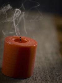 Close-up of tea light candle on table