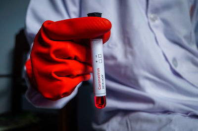 Close-up of hand on red