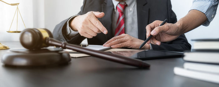 Midsection of man working at table