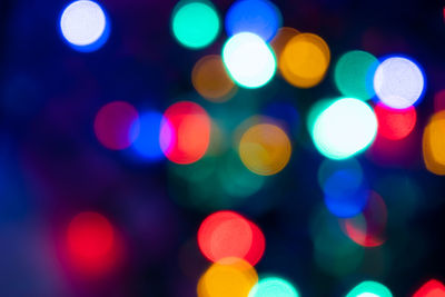 Defocused image of illuminated lights at night