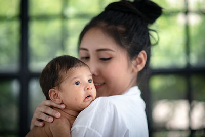 Portrait of mother and daughter outdoors