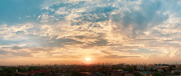 High angle view of buildings against sky during sunset