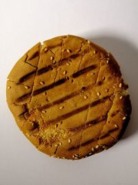 High angle view of cake against white background