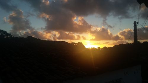 Silhouette mountains against sky during sunset