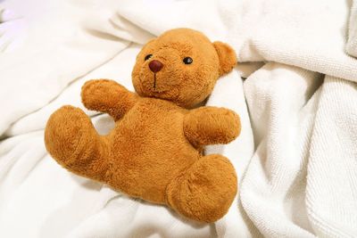 Close-up of stuffed toy on bed