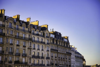 Low angle view of buildings against clear sky