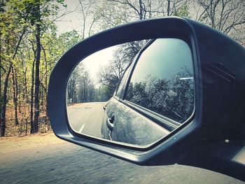 Reflection of car on side-view mirror