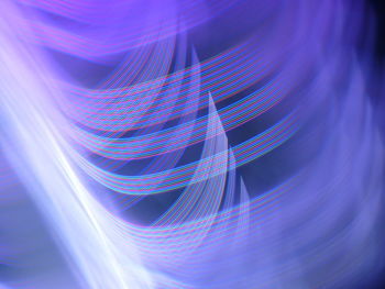 Close-up of light painting against black background