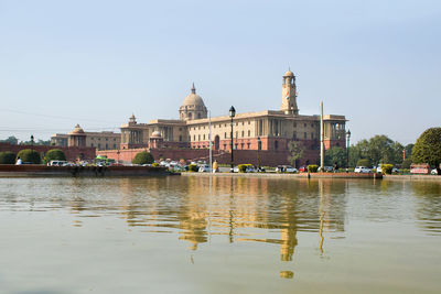 River by building against clear sky