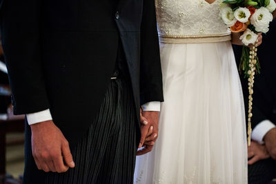 Midsection of newlywed couple