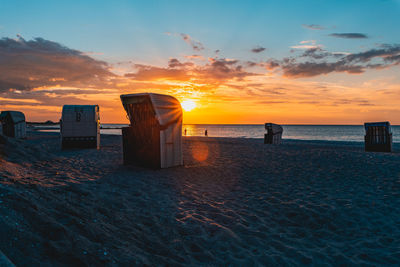 Scenic view of beach against sky during sunset