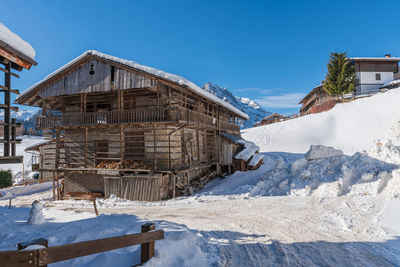 Winter magic. the ancient wooden houses of sauris di sopra. italy