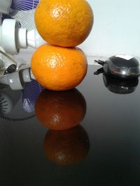 Close-up of oranges on table