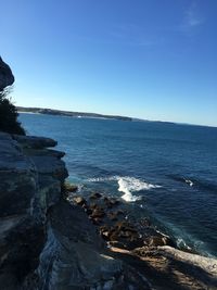 Scenic view of sea against clear blue sky