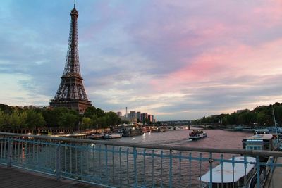 View of cityscape against cloudy sky