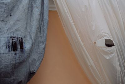 Close-up of curtain on wall at home