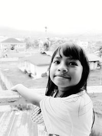 Portrait of girl standing outdoors