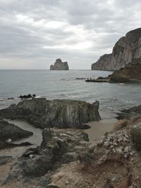 Scenic view of sea against cloudy sky