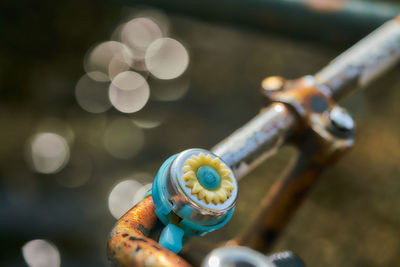 Close-up of bicycle with rope
